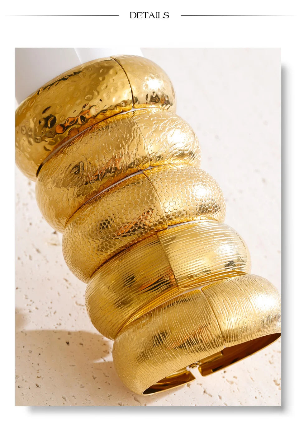 Hammered geometric bracelet in gold-plated stainless steel.