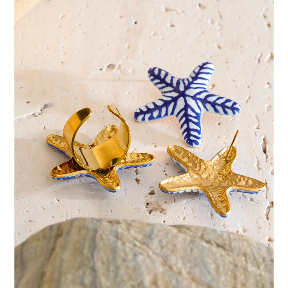 Blue star geometric earrings in gold-plated stainless steel.