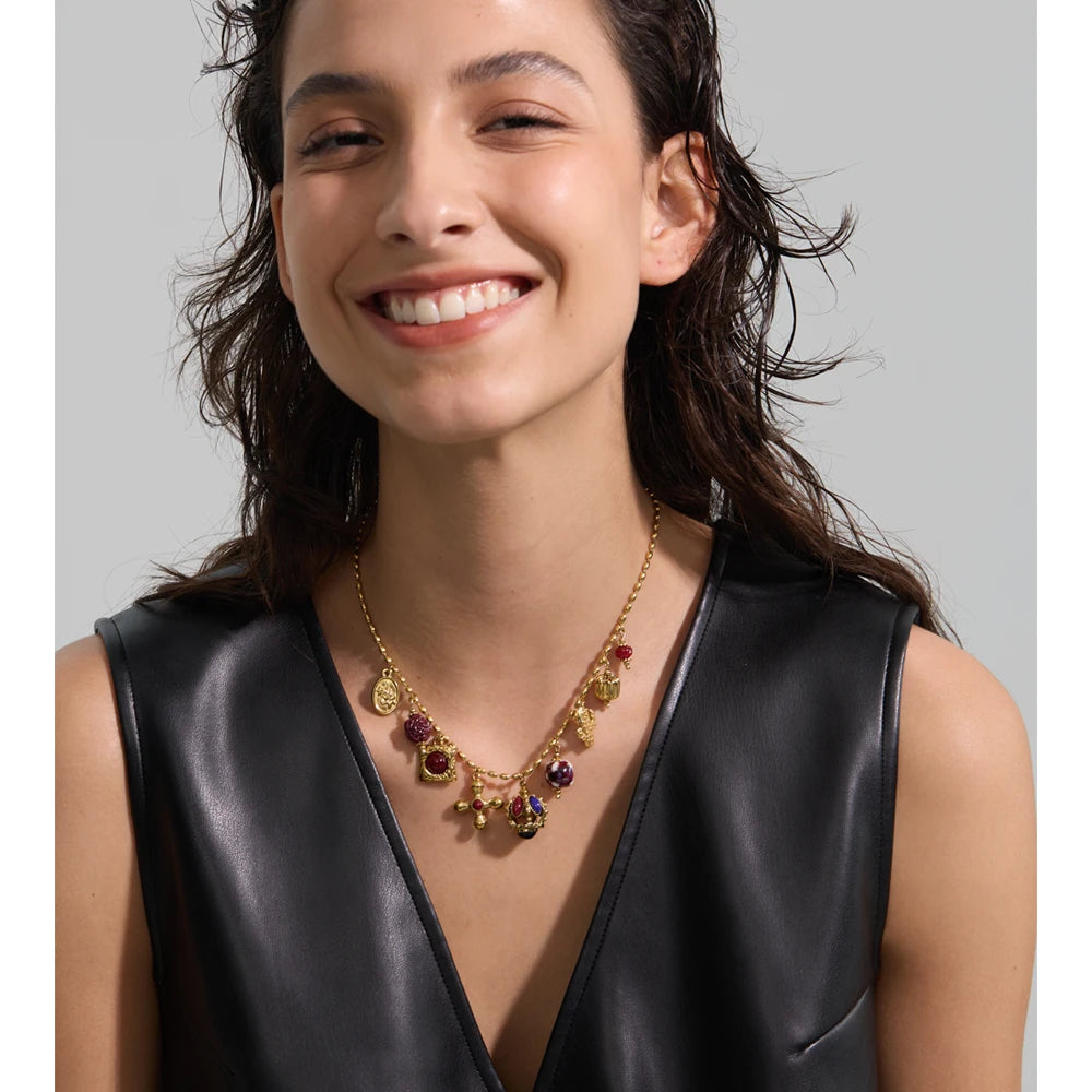 Resin acrylic cross necklace in gold-plated stainless steel with resin and acrylic.