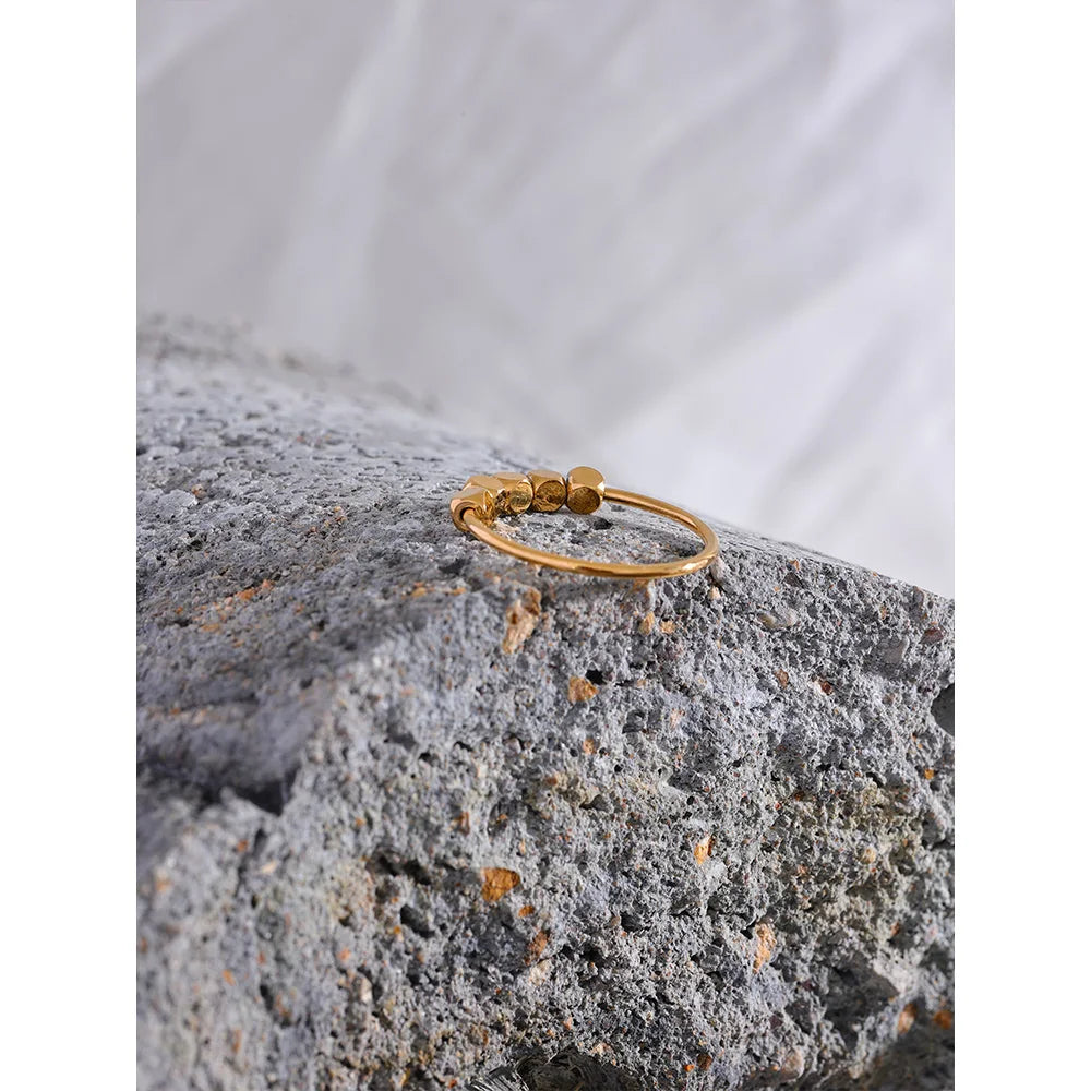 Beaded geometric ring in 18K gold-plated stainless steel.