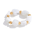 Natural stone geometric ring in 18K gold-plated stainless steel with natural stone.