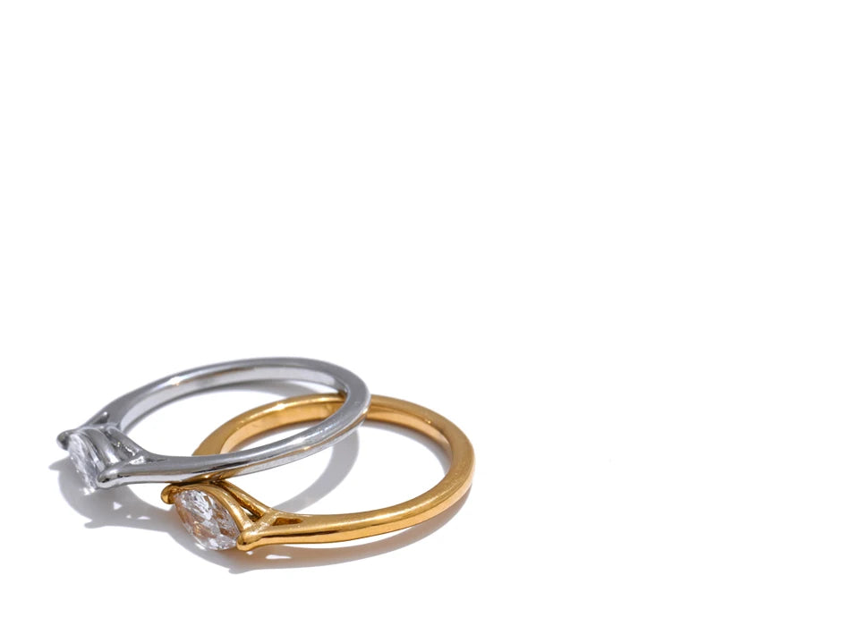 Cubic zirconia geometric ring in 18K gold-plated stainless steel with cubic zirconia.