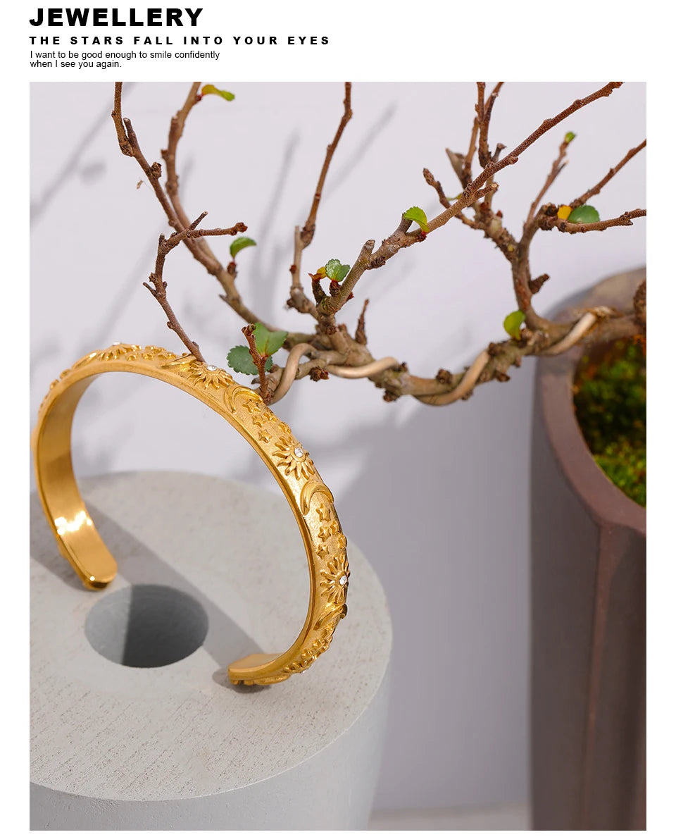 Star moon sun bracelet in gold-plated stainless steel.