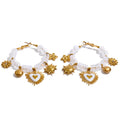 Resin acrylic heart earrings in gold-plated stainless steel with resin and acrylic.