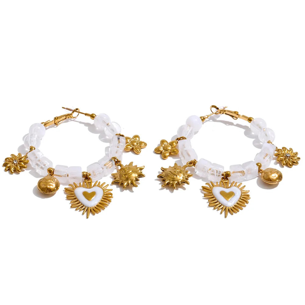 Resin acrylic heart earrings in gold-plated stainless steel with resin and acrylic.