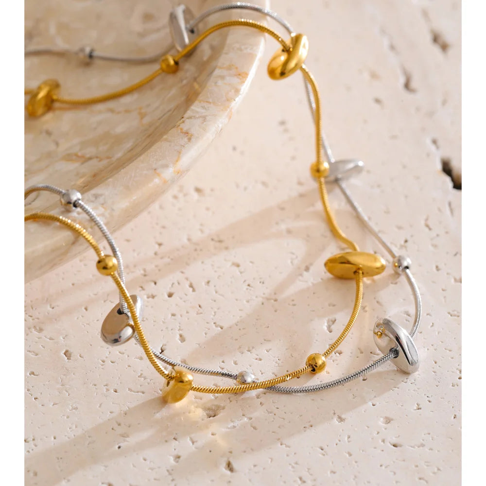 Geometric chain necklace in gold-plated stainless steel.