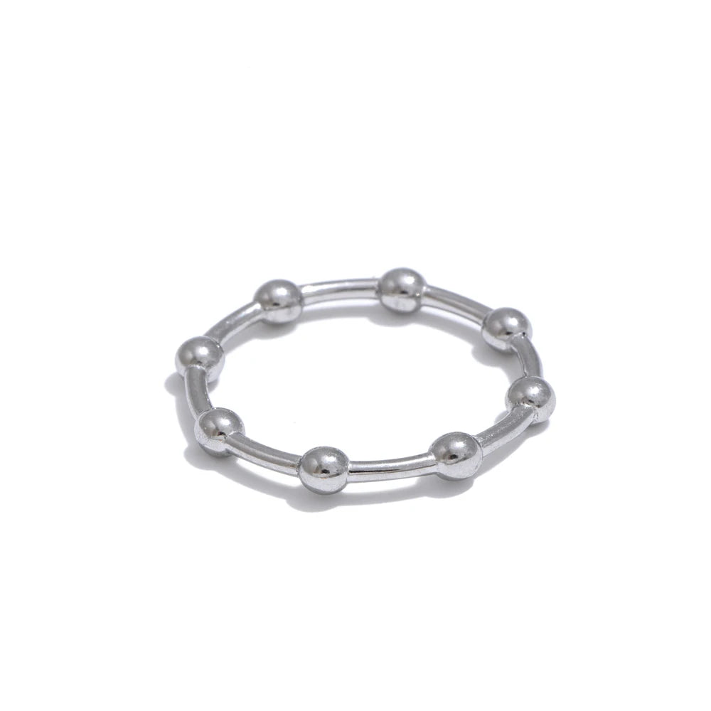 Beaded minimalist geometric ring in 18K gold-plated stainless steel.