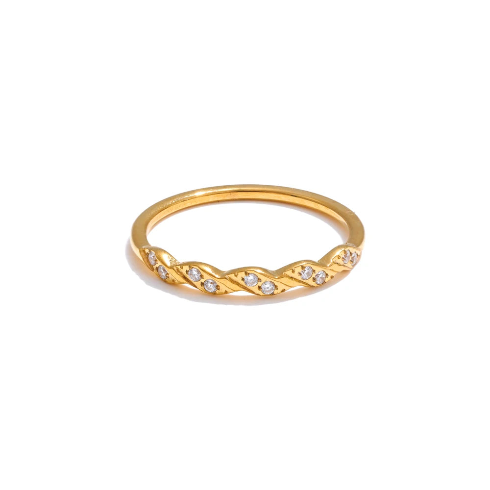 Cubic zirconia geometric ring in gold-plated stainless steel with cubic zirconia.