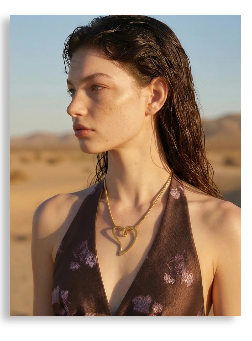 Heart necklace in gold-plated stainless steel.