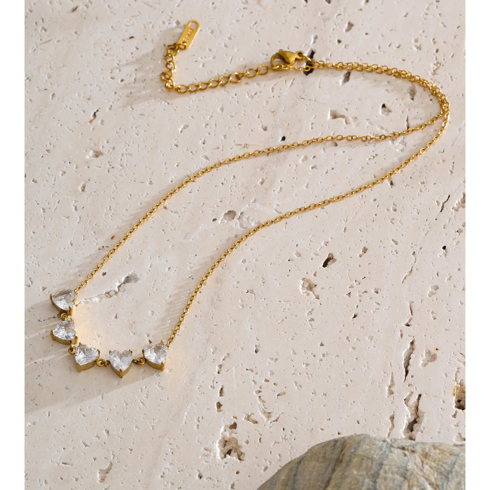 Cubic zirconia heart necklace in gold-plated stainless steel with cubic zirconia.