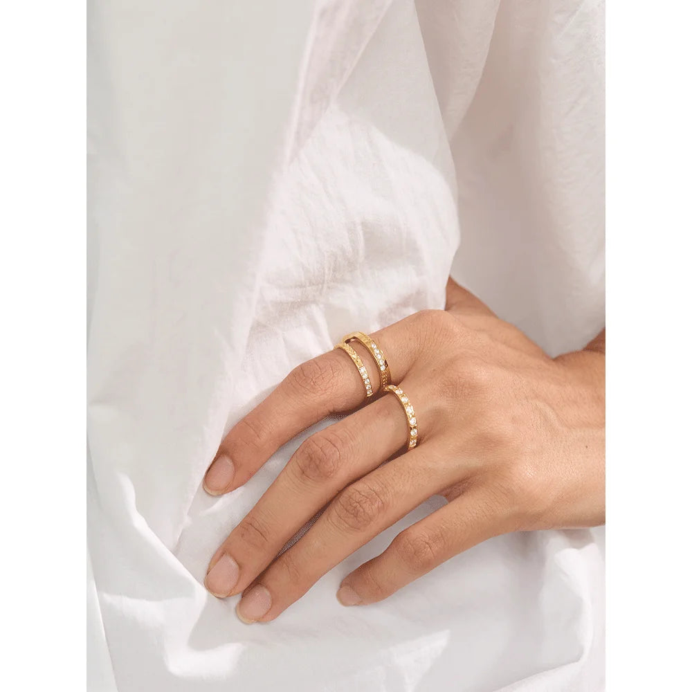 Cubic zirconia geometric ring in 18K gold-plated stainless steel with cubic zirconia.