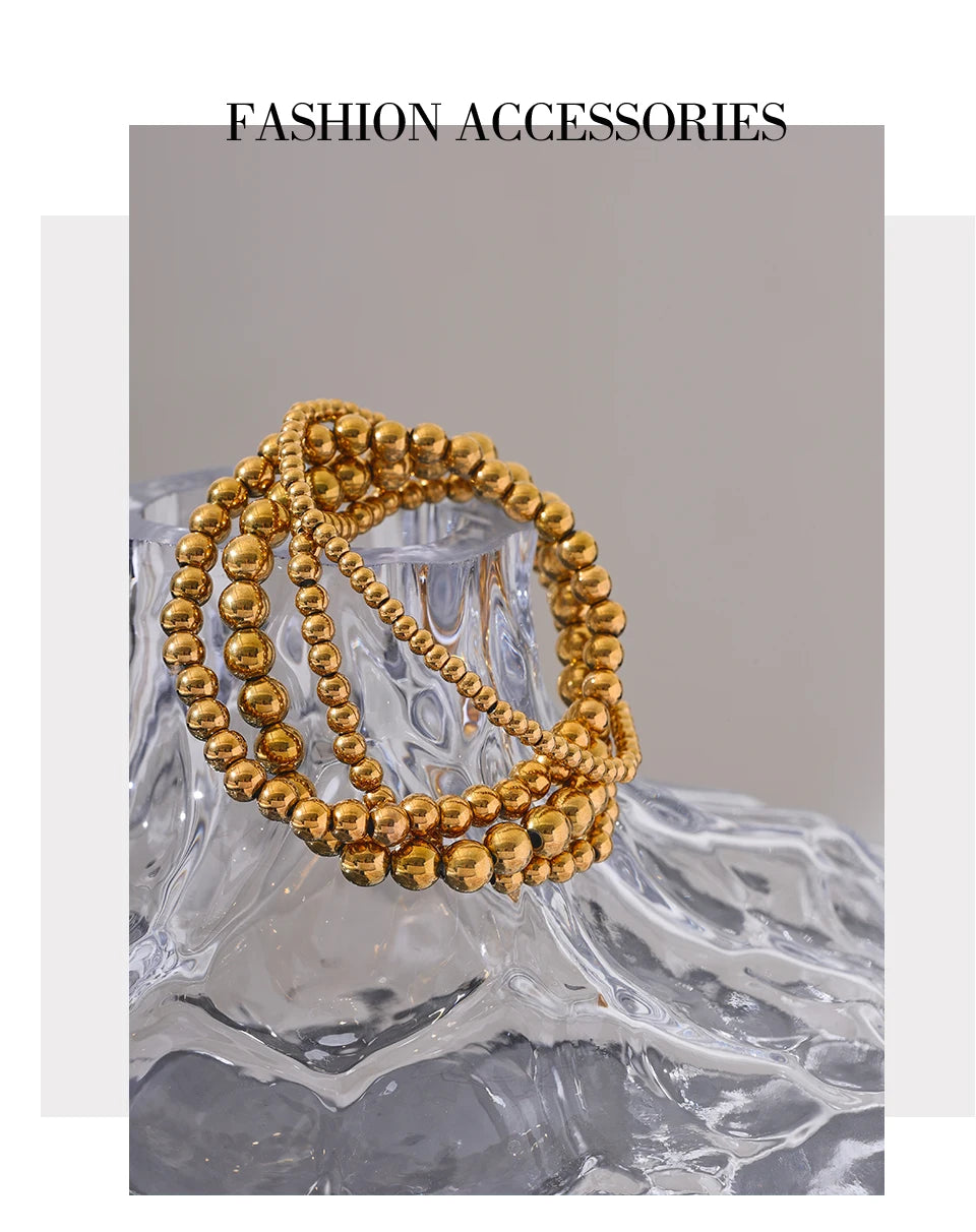Beaded geometric bracelet in gold-plated stainless steel.