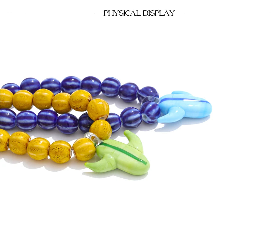 Blue beaded geometric necklace in gold-plated stainless steel.
