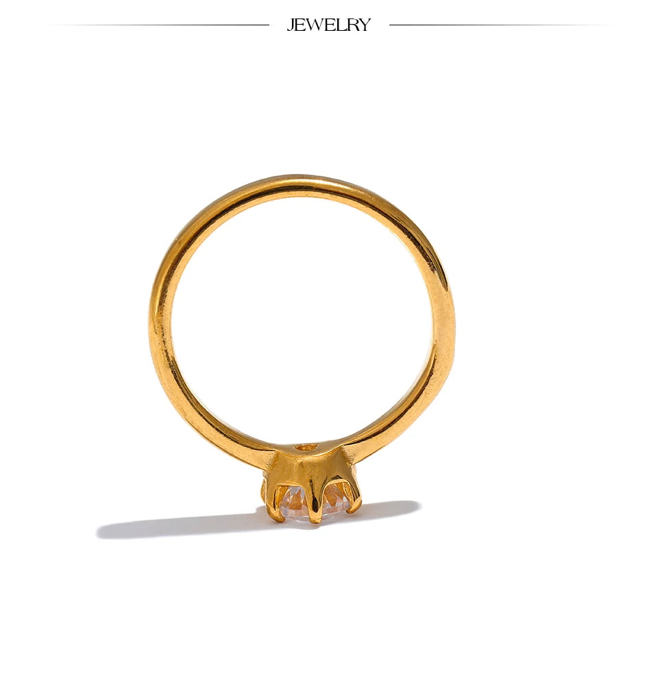 Cubic zirconia geometric ring in 18K gold-plated stainless steel with cubic zirconia.