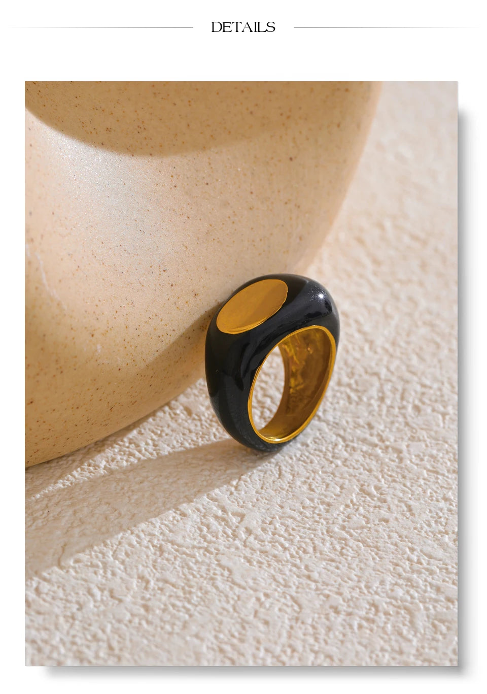 Black enamel geometric ring in gold-plated 316L stainless steel with enamel.