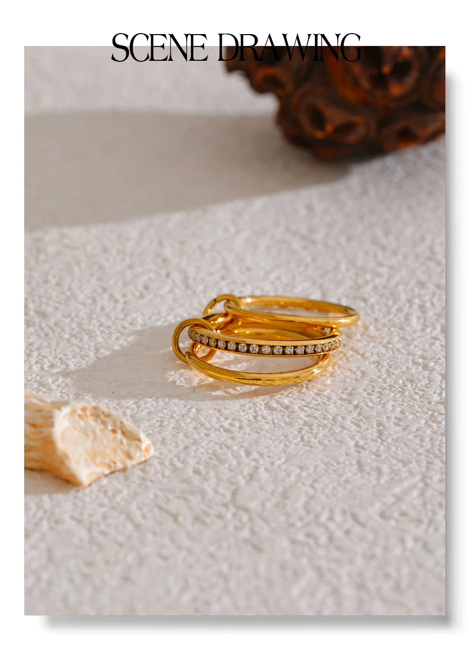 Cubic zirconia geometric layered ring in 18K gold-plated stainless steel with cubic zirconia.