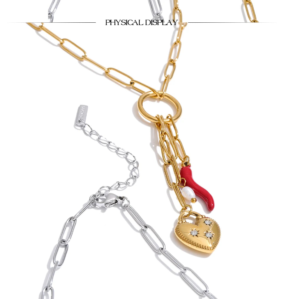 Cubic zirconia freshwater pearl heart necklace in gold-plated stainless steel with freshwater pearl and cubic zirconia.
