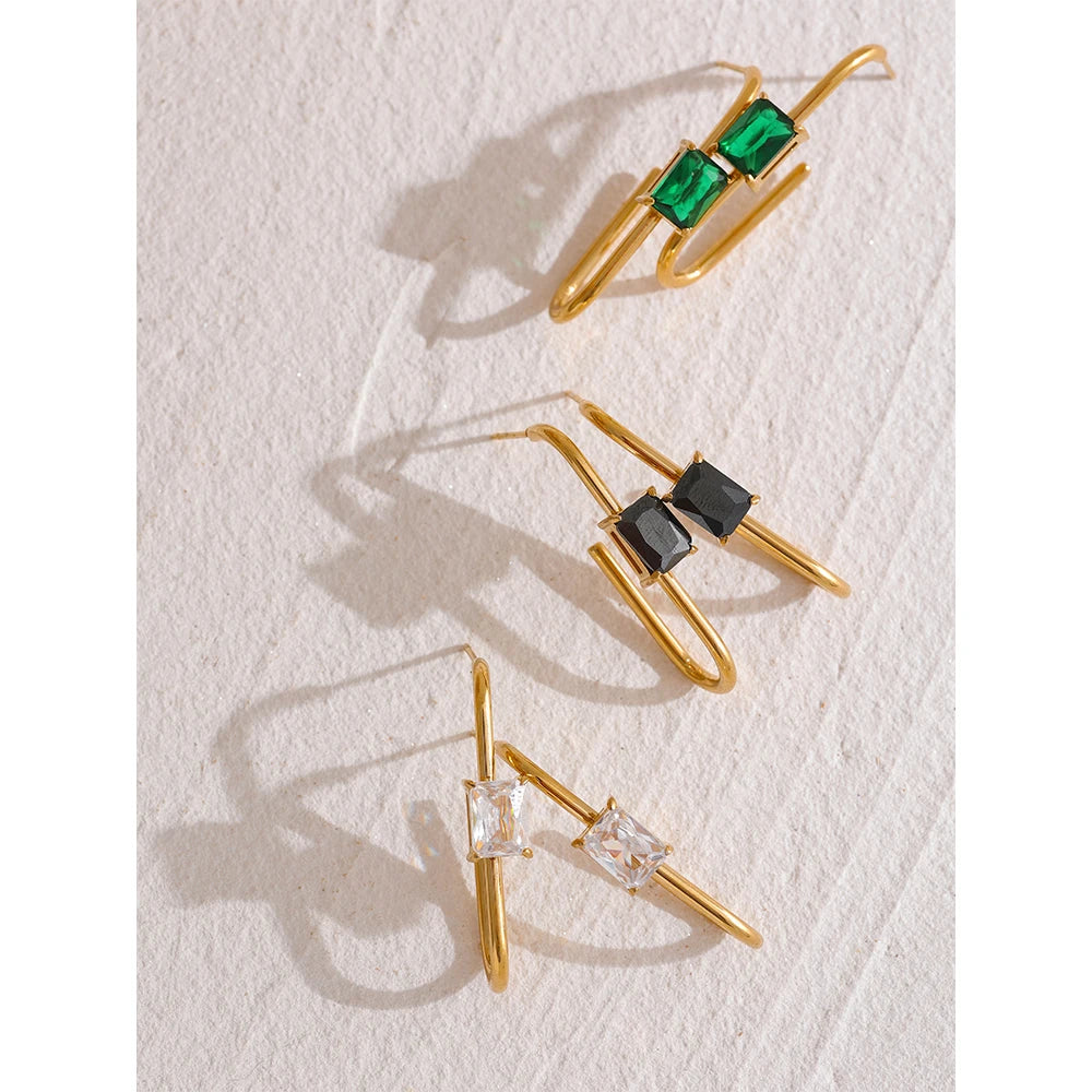 Black cubic zirconia geometric earrings in 18K gold-plated stainless steel with cubic zirconia.