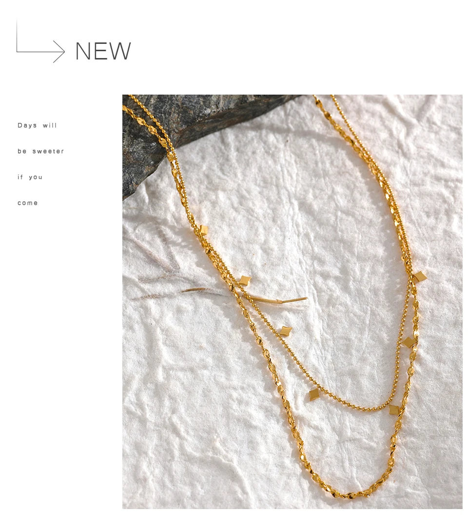 Geometric chain layered necklace in gold-plated stainless steel.