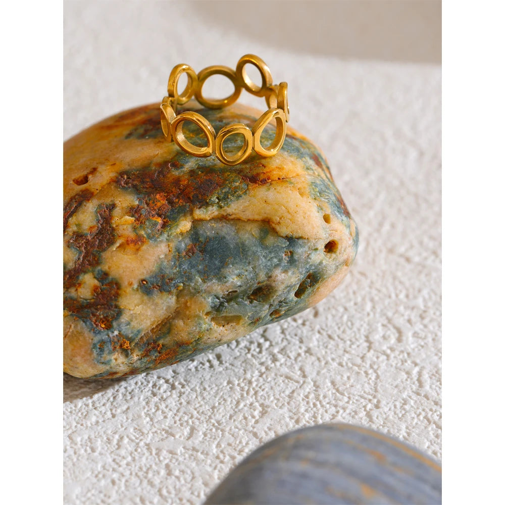 Geometric ring in 18K gold-plated stainless steel.
