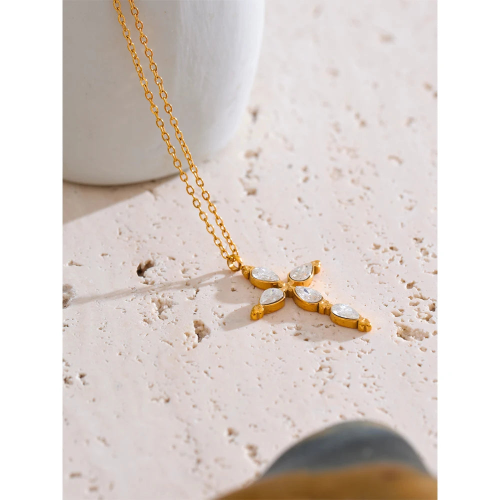 Cubic zirconia cross necklace in gold-plated stainless steel with cubic zirconia.