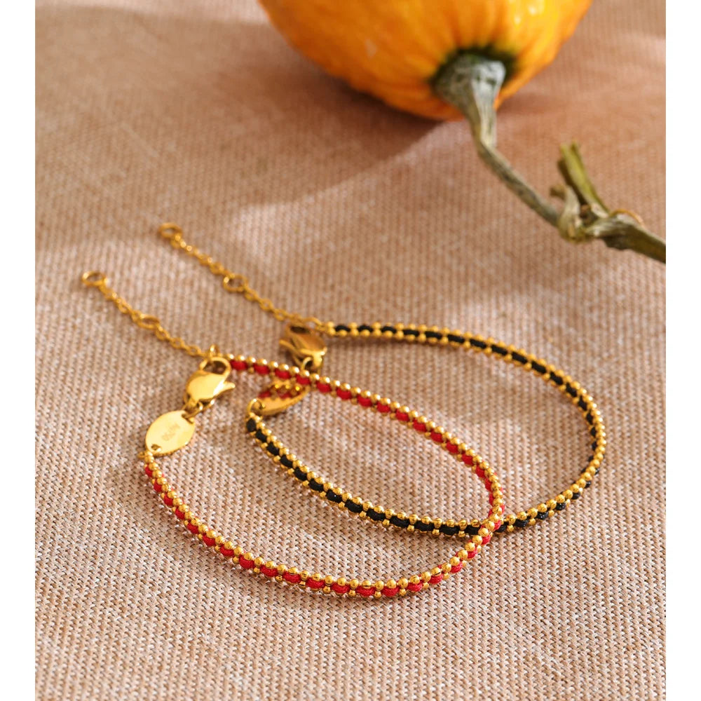 Black geometric chain necklace in gold-plated stainless steel.