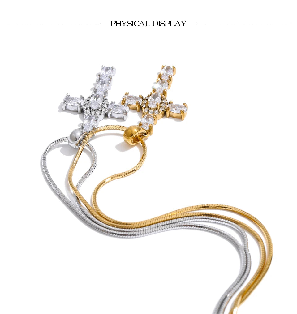 Cubic zirconia cross necklace in gold-plated stainless steel with cubic zirconia.