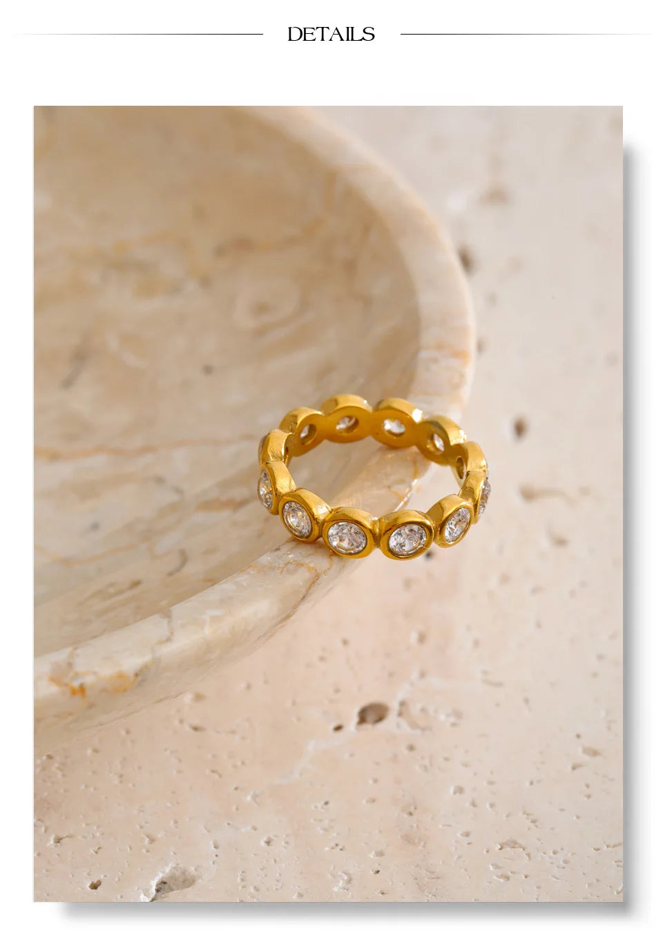 Cubic zirconia geometric ring in 18K gold-plated stainless steel with cubic zirconia.