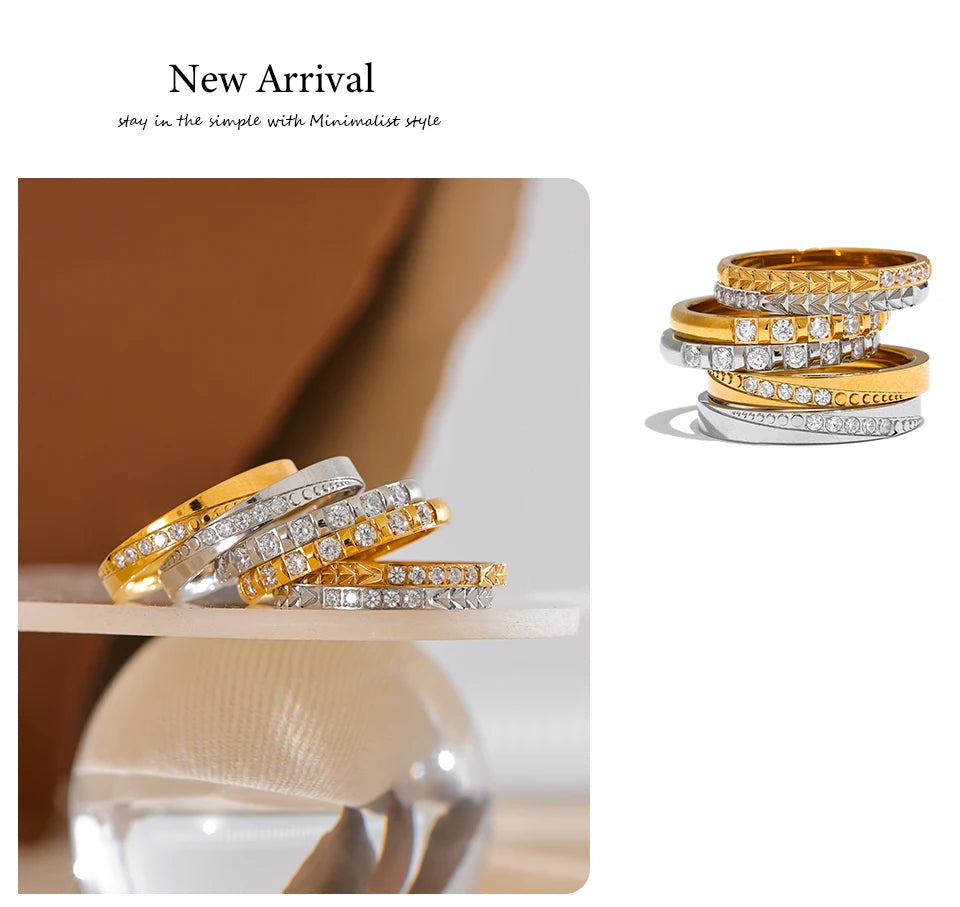 Cubic zirconia geometric ring in 18K gold-plated stainless steel with cubic zirconia.