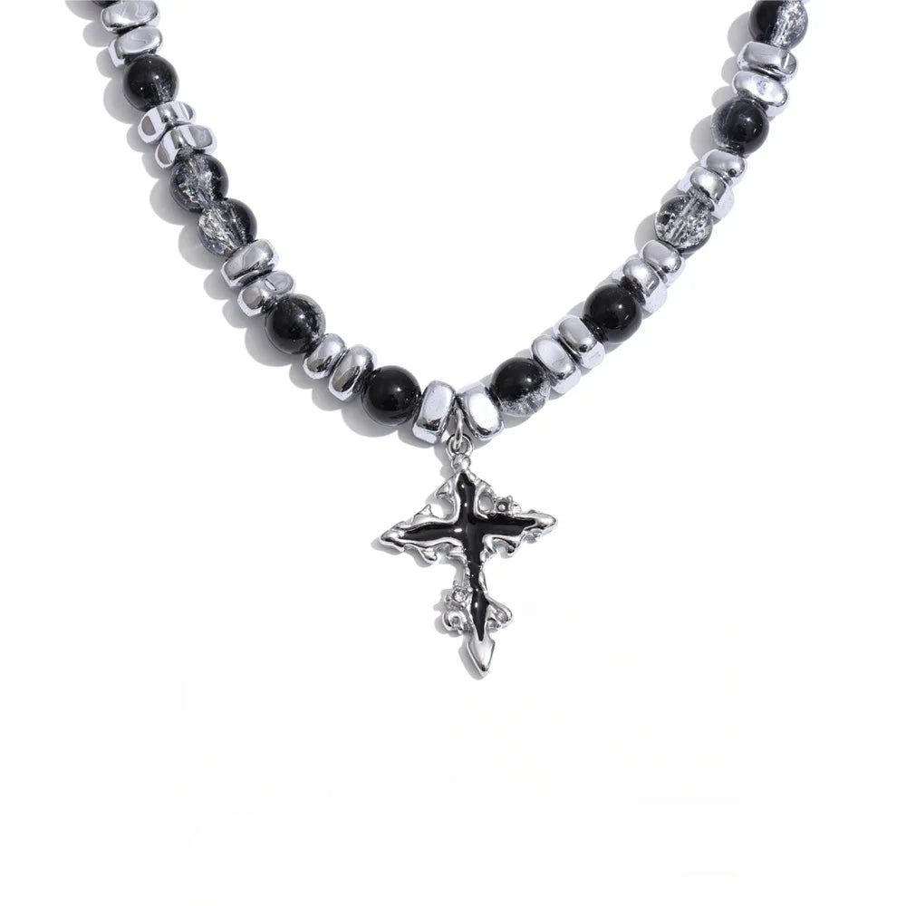 Gold-plated stainless steel necklace with black stone beads and a silver cross pendant.