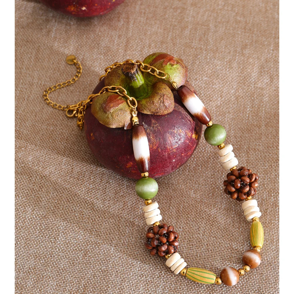 Beaded geometric chain necklace in gold-plated stainless steel.