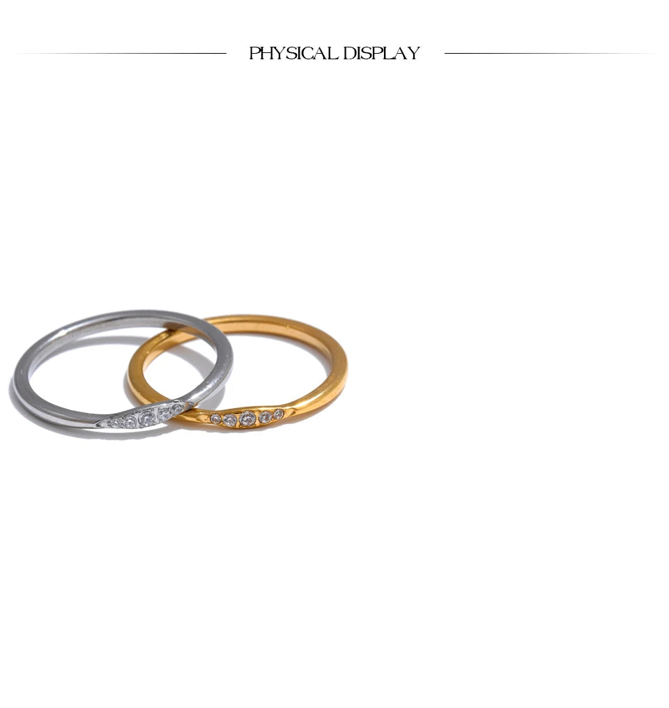 Cubic zirconia geometric ring in 18K gold-plated stainless steel with cubic zirconia.