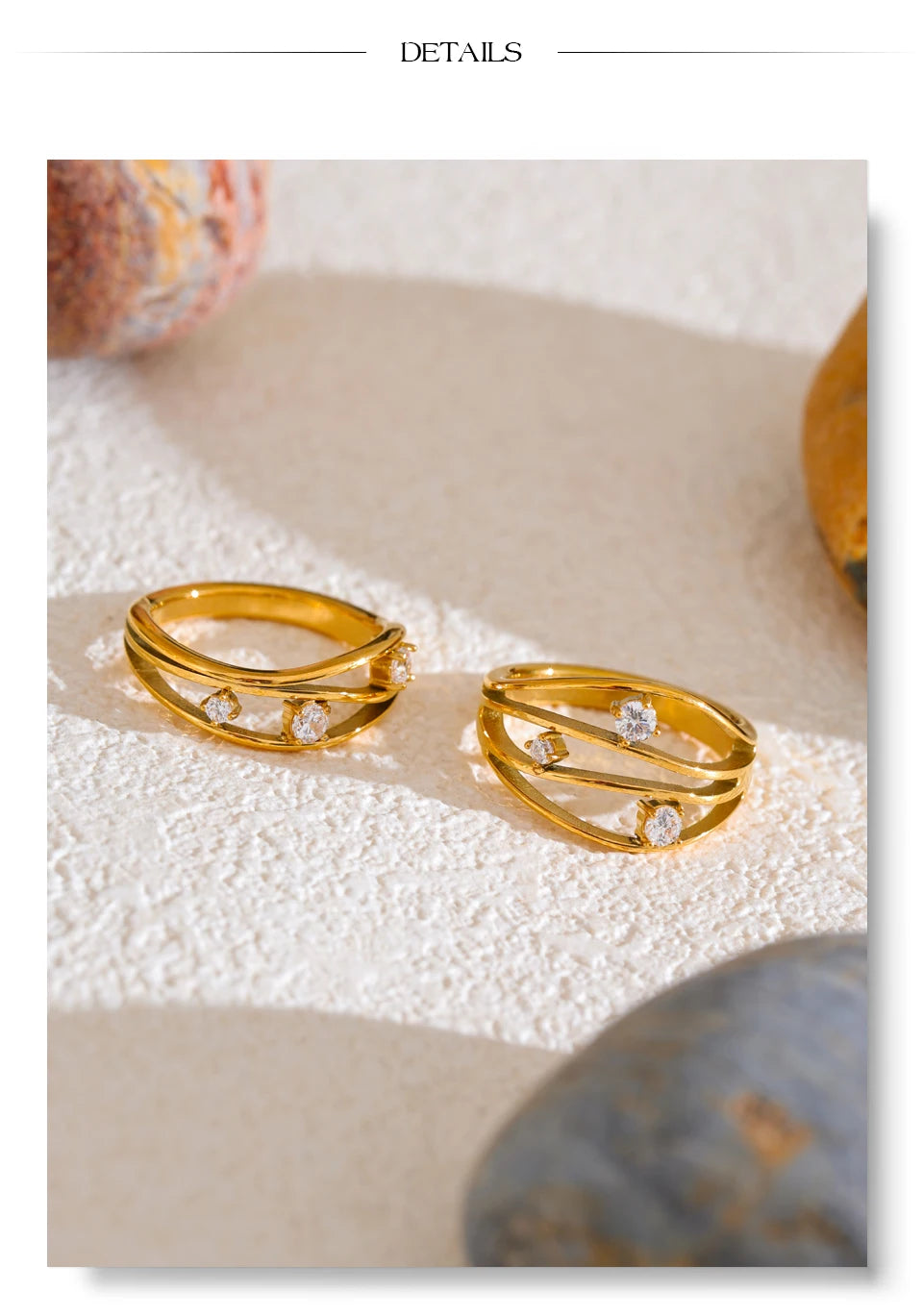 Cubic zirconia geometric ring in 18K gold-plated stainless steel with cubic zirconia.