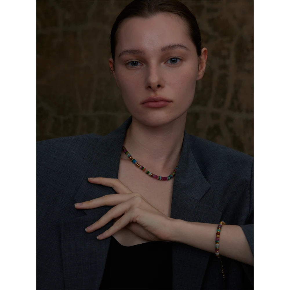 Natural stone beaded multi-color necklace in gold-plated stainless steel with natural stone.