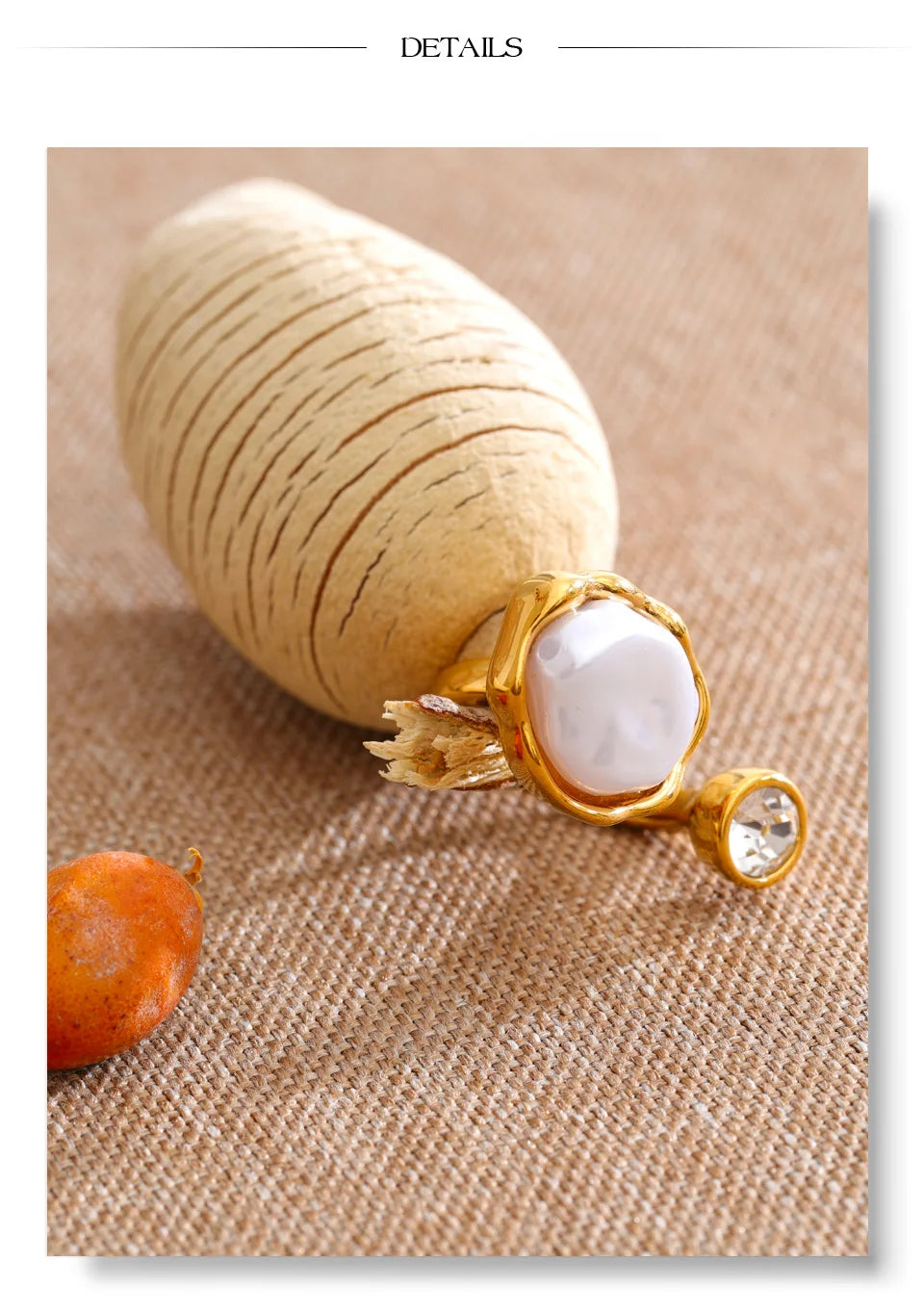 Cubic zirconia pearl geometric ring in 18K gold-plated stainless steel with pearl and cubic zirconia.