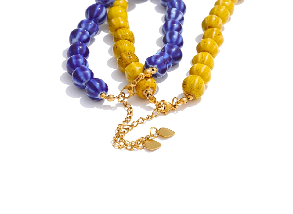 Blue beaded geometric necklace in gold-plated stainless steel.