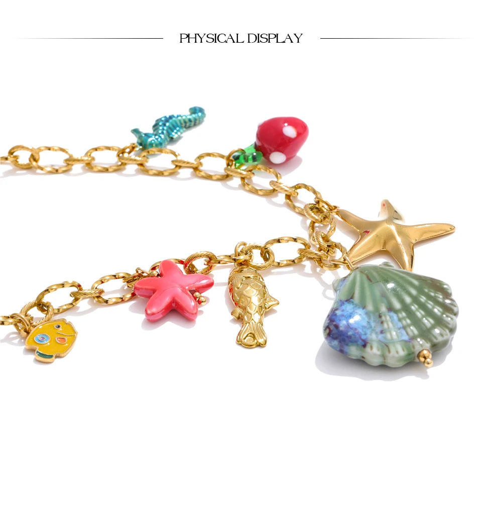 Shell enamel star necklace in gold-plated stainless steel with shell and enamel.