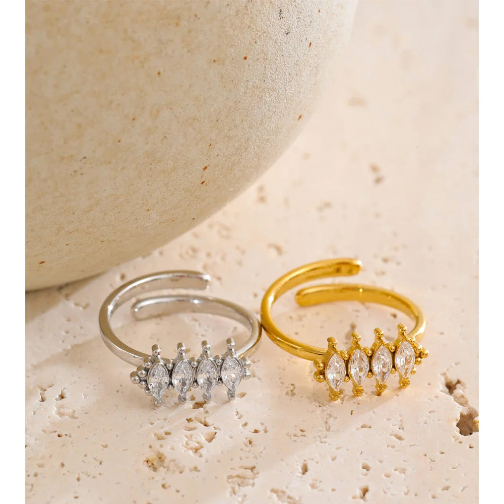 Cubic zirconia geometric ring in 18K gold-plated stainless steel with cubic zirconia.