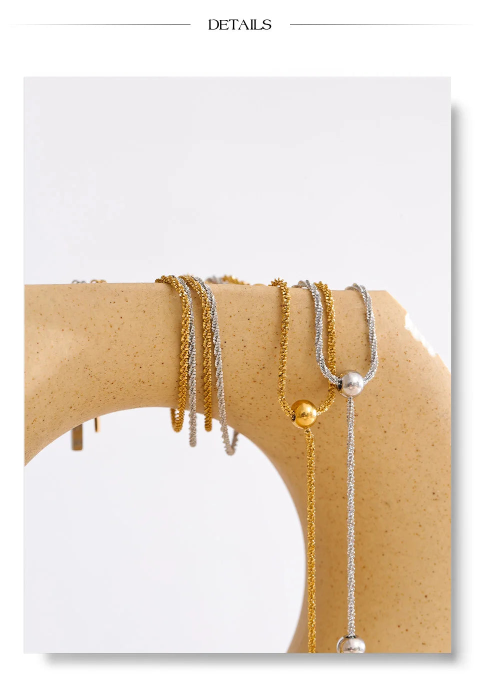 Beaded geometric chain necklace in gold-plated stainless steel.