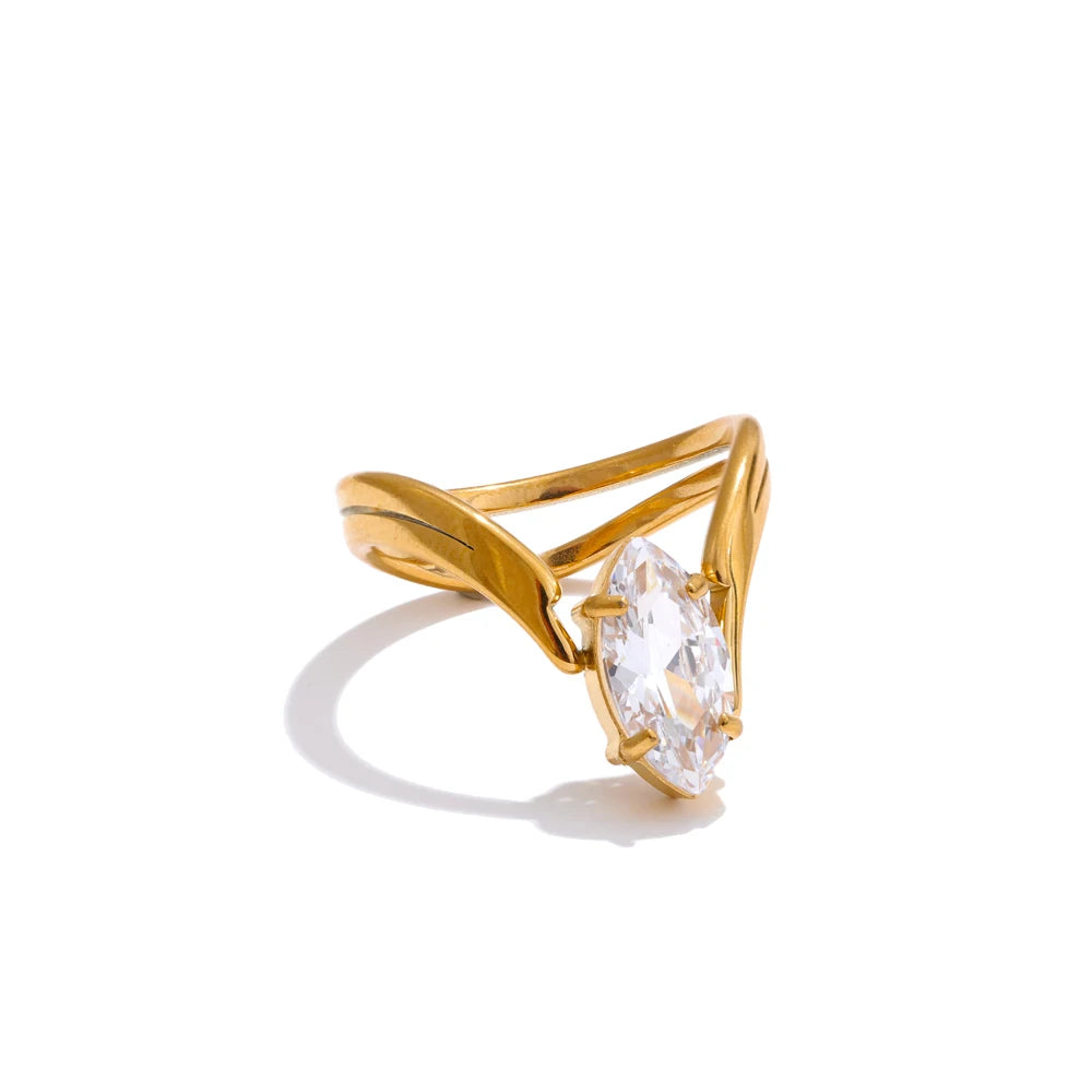 Cubic zirconia geometric ring in 18K gold-plated stainless steel with cubic zirconia.