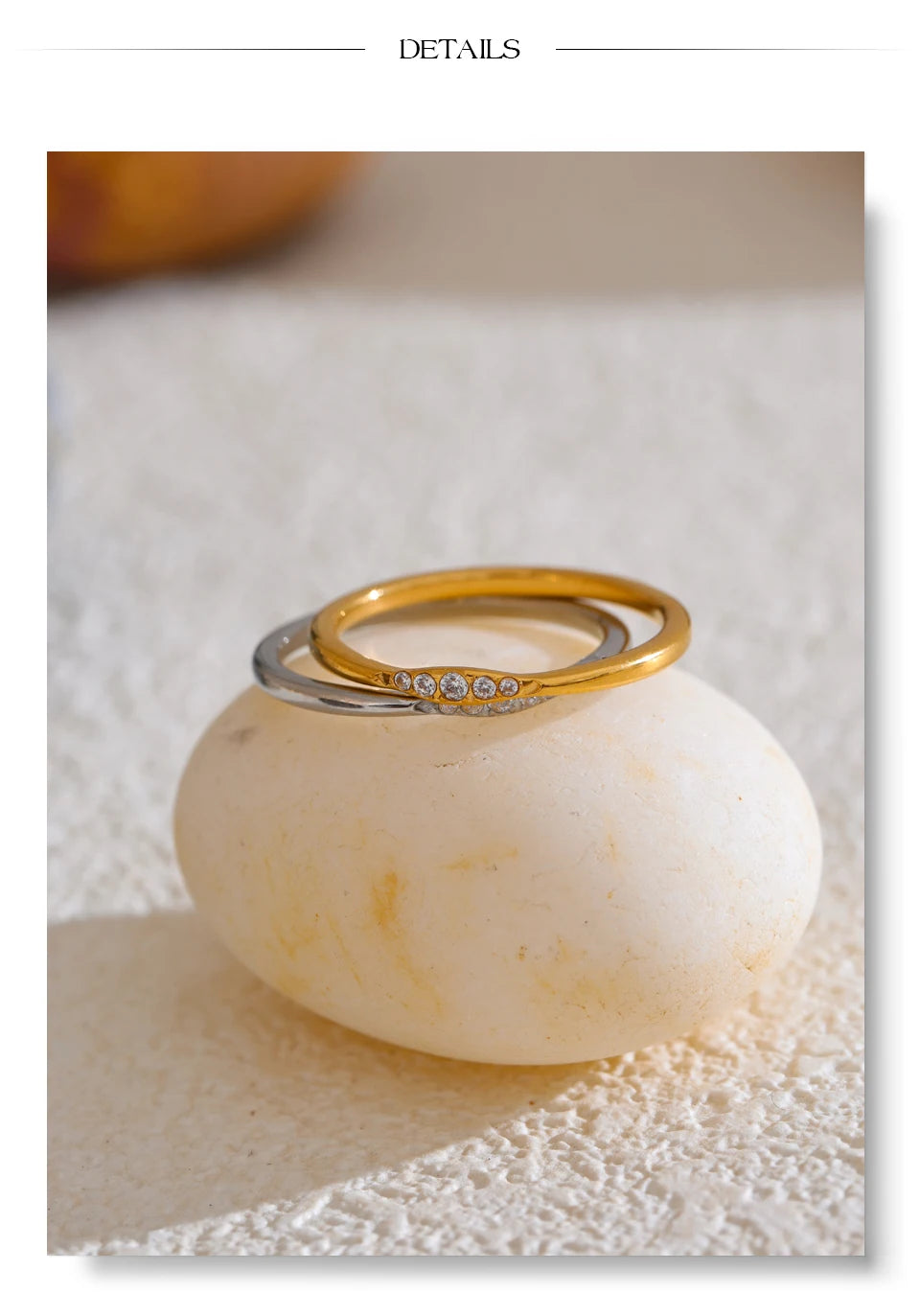 Cubic zirconia geometric ring in 18K gold-plated stainless steel with cubic zirconia.