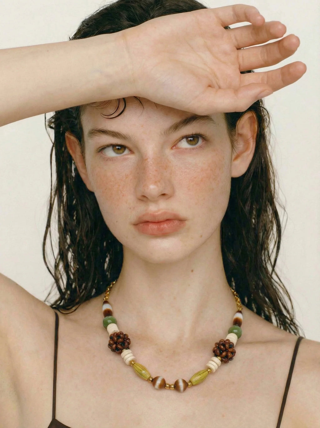 Beaded geometric chain necklace in gold-plated stainless steel.