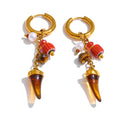 Resin geometric earrings in gold-plated stainless steel with resin.