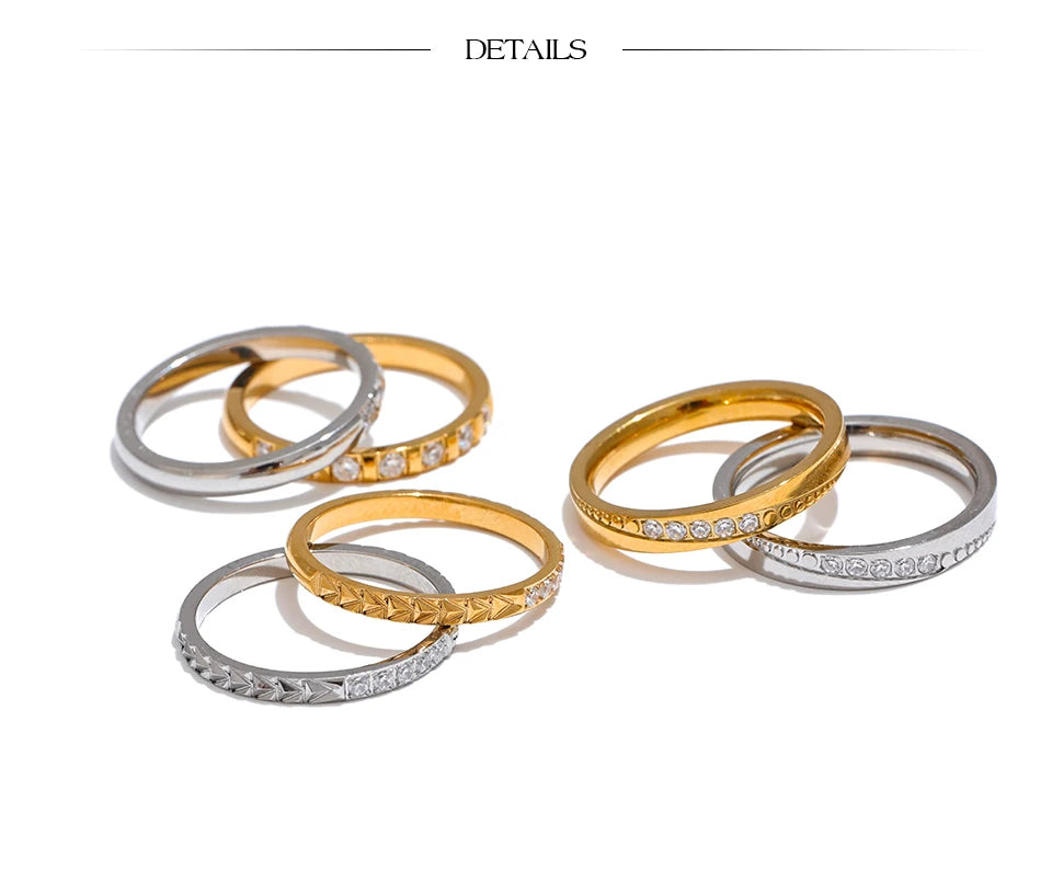 Cubic zirconia geometric ring in 18K gold-plated stainless steel with cubic zirconia.