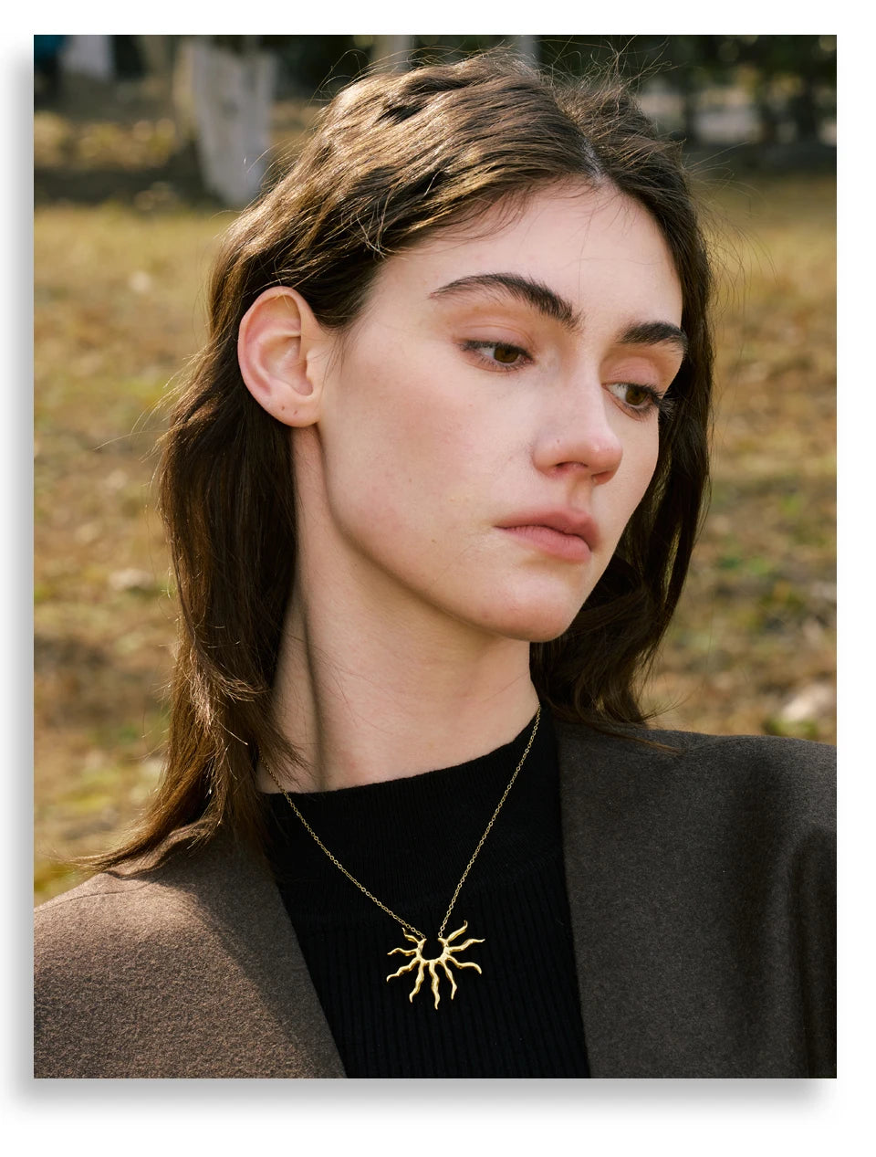 Sun geometric necklace in gold-plated stainless steel.