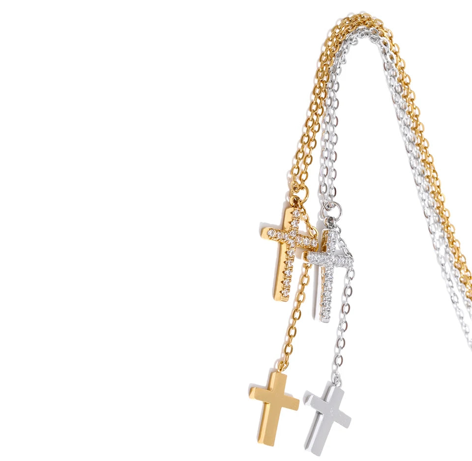 Cubic zirconia cross chain necklace in gold-plated stainless steel with cubic zirconia.