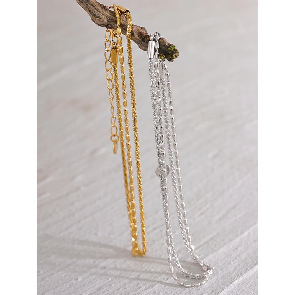 Geometric chain layered necklace in gold-plated stainless steel.