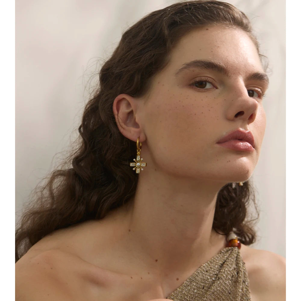 Cubic zirconia pearl cross earrings in gold-plated stainless steel with pearl and cubic zirconia.