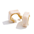 Resin acrylic geometric earrings in gold-plated stainless steel with resin and acrylic.