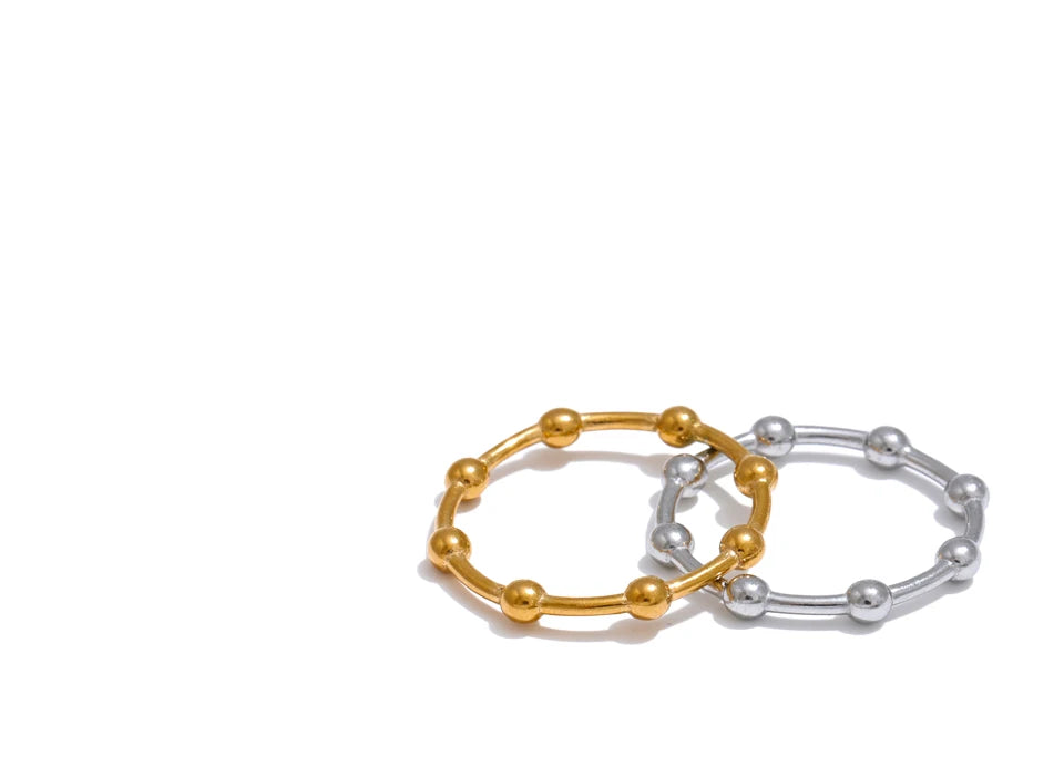 Beaded minimalist geometric ring in 18K gold-plated stainless steel.